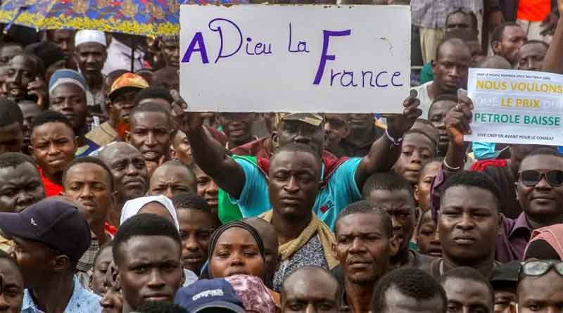 A protester holds a sign saying "goodbye France" at a rally in Niamey last month